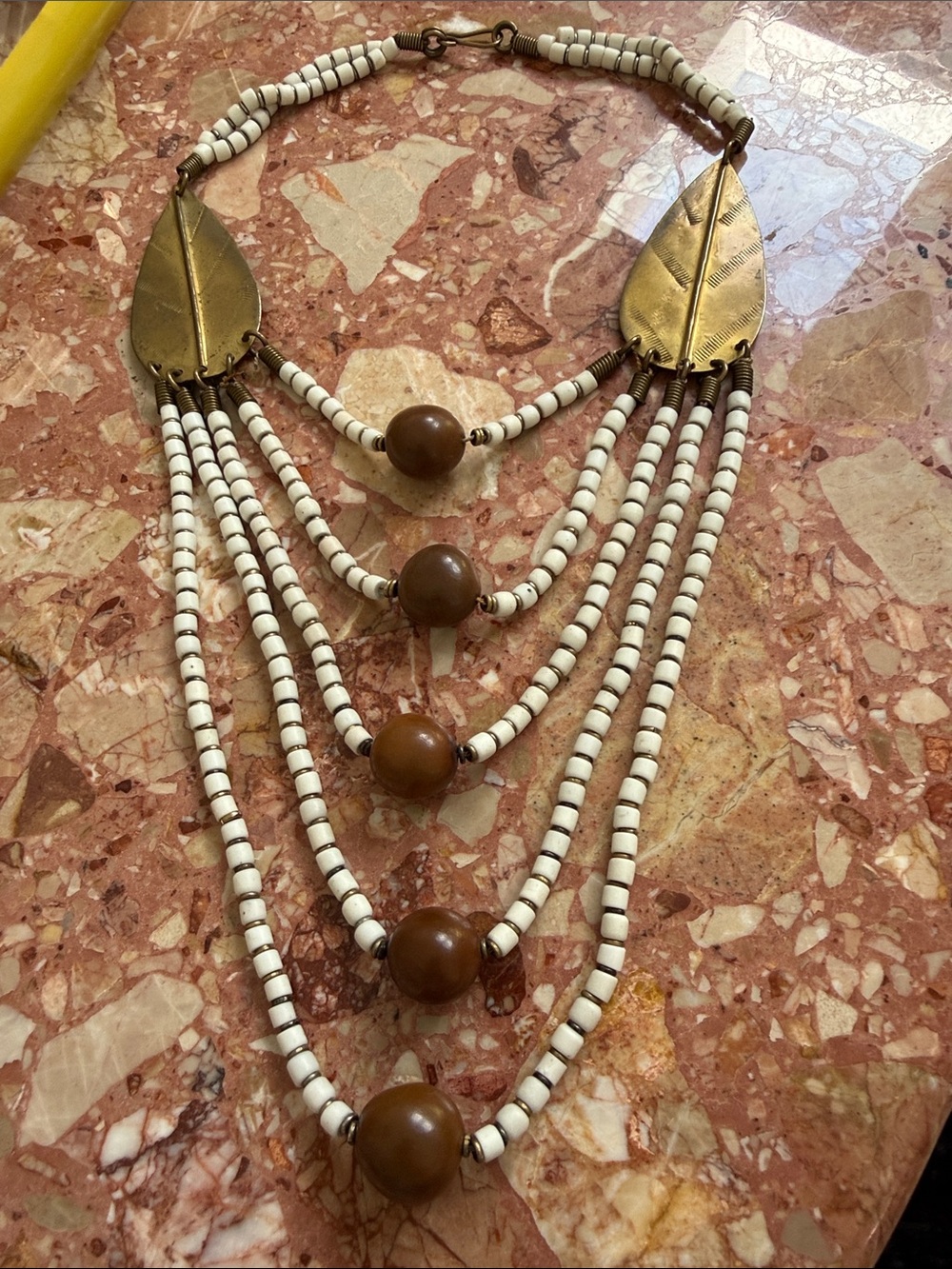 Layered White Bead and Brown Accent Necklace with Gold Leaf Details